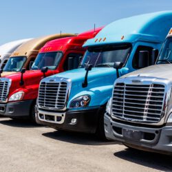 Indianapolis - Circa June 2018: Colorful Freightliner Semi Tractor Trailer Trucks Lined up for Sale. Freighliner is owned by Dailmer Trucks I